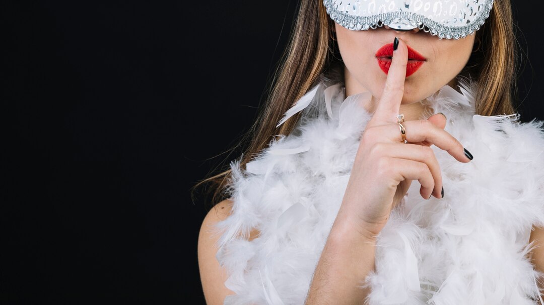Close Up Woman Wearing Carnival Mask With Finger Her Lips